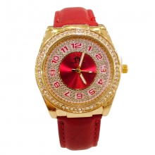 Montre-bracelet dorée pour femme agrémentée de strass